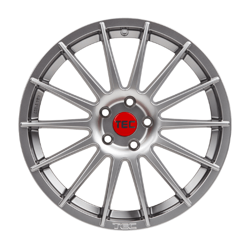 Silberne Mehrspeichen-Autofelge mit roter Nabenkappe und TEC-Aufschrift auf weißem Hintergrund