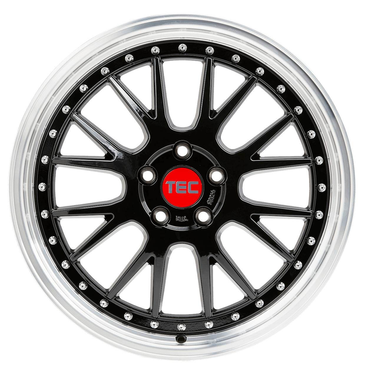 Schwarze und silberne Alufelge mit roter TEC-Nabenkappe, von oben auf weißem Hintergrund fotografiert